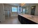 Bright bathroom showcasing a double sink vanity, a soaking tub, and a separate glass-enclosed shower at 1731 Caribbean View Ter, Kissimmee, FL 34747