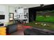 Fun game room featuring a sports simulator, comfortable seating, and playful decor, perfect for entertainment and relaxation at 1731 Caribbean View Ter, Kissimmee, FL 34747
