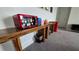 A wooden table and a vintage Coca-Cola themed beverage cooler add to the living room's charm at 1731 Caribbean View Ter, Kissimmee, FL 34747