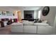 A large, sun-filled living room with comfortable seating and modern decor at 1731 Caribbean View Ter, Kissimmee, FL 34747