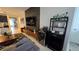 Stylish bar area is featured within the living room with a sleek beverage cooler and shelving at 1731 Caribbean View Ter, Kissimmee, FL 34747