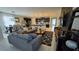 Spacious open-concept living room with modern decor and an abundance of natural light at 1731 Caribbean View Ter, Kissimmee, FL 34747