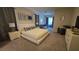 Spacious main bedroom with a sitting area, a walk-in closet, and neutral carpet at 1731 Caribbean View Ter, Kissimmee, FL 34747