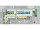 Aerial view of the planned community layout showing ponds and future development. Lots are marked in color at 179 River Front Way, Edgewater, FL 32141