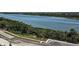 Scenic water view of a wide river lined with trees and featuring a neighborhood road at 183 River Front Way, Edgewater, FL 32141