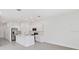 Open concept kitchen boasts stainless appliances and center island at 185 River Front Way, Edgewater, FL 32141