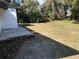 Expansive back yard showcasing lots of greenery and potential for outdoor activities at 2013 Bates Ave, Eustis, FL 32726