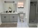 Bright bathroom featuring double vanity with modern fixtures and a walk-in shower at 2013 Bates Ave, Eustis, FL 32726