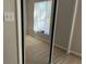 Bedroom view featuring a mirror sliding door closet at 2013 Bates Ave, Eustis, FL 32726