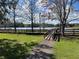 Scenic view of lake with a small wooden bridge and boardwalk, surrounded by trees at 2013 Bates Ave, Eustis, FL 32726