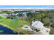 Stunning aerial view of home featuring an in-ground pool, river frontage, and lush landscaping at 2045 Green Cedar Ln, Geneva, FL 32732