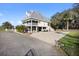 Stunning raised beach house with metal roof, screened porch, and ample parking space at 2045 Green Cedar Ln, Geneva, FL 32732