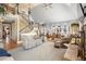 Bright and airy living room featuring a fireplace, hardwood floors, and elegant staircase at 2045 Green Cedar Ln, Geneva, FL 32732