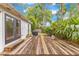 Backyard deck with a grill and tropical greenery at 208 Whittier Cir, Orlando, FL 32806