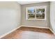 Empty bedroom featuring geometrically patterned floors, neutral wall paint, and a bright window at 208 Whittier Cir, Orlando, FL 32806