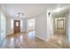 Bright foyer featuring wood flooring, a decorative front door, and a view into living spaces at 2123 Alameda St, Orlando, FL 32804