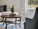 Living room close up featuring a round coffee table, modern decorations, and comfortable furniture at 2222 Lake Preserve Cir, New Smyrna Beach, FL 32168