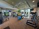 Well-equipped gym with modern fitness equipment and ample natural light at 2369 Palm Park Loop, Clermont, FL 34714