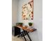 Hallway decor features a stylish console table, artwork and beverage cooler, enhancing the home's ambiance at 2369 Palm Park Loop, Clermont, FL 34714