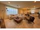 Open-concept living room connected to the kitchen and dining area with natural light at 2369 Palm Park Loop, Clermont, FL 34714