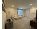 A living room with a comfortable couch, carpeted floors, and a stylish box and pictures as decor at 2369 Palm Park Loop, Clermont, FL 34714
