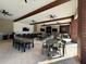 Open air patio featuring ceiling fans, a bar and multiple seating and dining areas at 2369 Palm Park Loop, Clermont, FL 34714