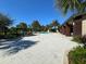 Community pool deck featuring a pool and lounge chairs and lush landscaping at 2369 Palm Park Loop, Clermont, FL 34714