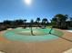 Community splash pad surrounded by lush landscaping and palm trees on a sunny day at 2369 Palm Park Loop, Clermont, FL 34714