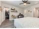 Bright bedroom featuring hard flooring, a ceiling fan, a walk-in closet and an ensuite bathroom at 2623 Buena View Rd, Kissimmee, FL 34746