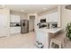 Modern kitchen featuring stainless steel appliances, white cabinets, quartz countertops, and breakfast bar with seating at 2623 Buena View Rd, Kissimmee, FL 34746