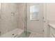 Modern shower with glass door and tiled walls with a built in alcove at 2623 Buena View Rd, Kissimmee, FL 34746