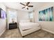 Inviting bedroom with a luxurious bed, bedside tables, and modern artwork for a serene atmosphere at 300 Burma St, Kissimmee, FL 34747
