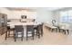 Spacious kitchen with an oversized island, stainless steel appliances, and ample seating at 300 Burma St, Kissimmee, FL 34747
