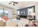 Open-plan living room with large windows to the lanai that provide natural light at 300 Burma St, Kissimmee, FL 34747