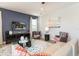 Comfortable living room featuring stylish furnishings, a modern rug, and a TV wall mount at 300 Burma St, Kissimmee, FL 34747
