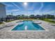 Backyard oasis with pool, spa, and lounge chairs perfect for relaxation at 300 Burma St, Kissimmee, FL 34747
