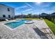 Backyard oasis with pool, spa, and lounge chairs for relaxation at 300 Burma St, Kissimmee, FL 34747