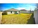 Spacious backyard featuring a patio with outdoor seating, ideal for entertaining and enjoying the outdoors at 313 Estates Ct, Haines City, FL 33844