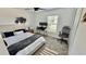 Bedroom with carpet, neutral decor, and a large window, providing plenty of natural light at 313 Estates Ct, Haines City, FL 33844