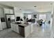 Modern kitchen featuring stainless steel appliances, a kitchen island, and an open floor plan at 313 Estates Ct, Haines City, FL 33844