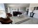 Inviting living room with tile floors, neutral decor, modern furnishings, and plenty of natural light at 313 Estates Ct, Haines City, FL 33844