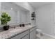 Modern bathroom with double vanity, granite countertop, and decorative potted plant at 3350 Private Oak Dr, Apopka, FL 32703