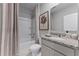 A well-lit bathroom with a shower-tub combo, granite countertop, and neutral-toned decor at 3350 Private Oak Dr, Apopka, FL 32703