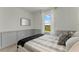 A cozy bedroom with a large window, plush bedding, and stylish decor at 3350 Private Oak Dr, Apopka, FL 32703