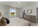Bedroom featuring a neutral color scheme, a window with scenic views, and an ensuite bathroom at 3350 Private Oak Dr, Apopka, FL 32703
