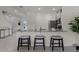 Kitchen island with seating and modern pendants at 3350 Private Oak Dr, Apopka, FL 32703