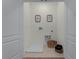 Laundry room area with tile flooring, utility connections, and convenient storage accessories at 3350 Private Oak Dr, Apopka, FL 32703
