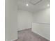 An upstairs loft area featuring neutral carpet, white walls, and plenty of natural light at 3350 Private Oak Dr, Apopka, FL 32703