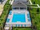 Aerial view of a community pool surrounded by lounge chairs, palm trees, and lush landscaping at 3350 Private Oak Dr, Apopka, FL 32703