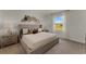 Comfortable bedroom featuring neutral tones, a large window and carpeted floor at 3368 Private Oak Dr, Apopka, FL 32703